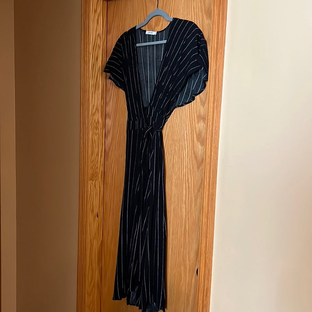 Perfect for summer.  New black and white wrap dress.  Never worn.